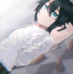  1girl androgynous black_hair blue_eyes blurry bullet closed_mouth collared_shirt commentary depth_of_field expressionless eyelashes hair_between_eyes kino kino_no_tabi long_sleeves looking_at_viewer luo. lying on_back shirt short_hair tomboy white_shirt 