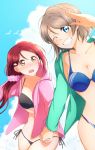  2girls bikini black_bikini blue_bikini blue_eyes blush collarbone green_jacket grey_hair grin hair_ornament hair_over_shoulder hairclip hand_holding highres hood hood_down hooded_jacket jacket long_hair long_sleeves looking_at_another looking_at_viewer love_live! love_live!_sunshine!! low-tied_long_hair multiple_girls nose_blush one_eye_closed outdoors pink_jacket pink_scrunchie polka_dot polka_dot_scrunchie redhead sakurauchi_riko salute scrunchie short_hair side-tie_bikini smile swimsuit watanabe_you yellow_eyes yuchi_(salmon-1000) 