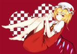  1girl barefoot blonde_hair commentary eyebrows_visible_through_hair flan_(seeyouflan) flandre_scarlet frown full_body highres knees_to_chest looking_at_viewer puffy_short_sleeves puffy_sleeves red_background red_eyes red_shirt red_skirt shirt short_sleeves simple_background skirt skirt_set solo touhou 