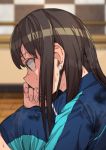  1girl black_hair blue_jacket commentary earrings erere idolmaster idolmaster_cinderella_girls jacket jewelry long_hair profile shibuya_rin sitting solo sweat sweat_stain sweating tile_wall tiles track_jacket 