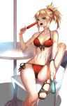  1girl arm_support bikini blonde_hair bottle fate/apocrypha fate/grand_order fate_(series) front-tie_top full_body green_eyes highres hot_dog long_hair mordred_(fate) mordred_(fate)_(all) mordred_(swimsuit_rider)_(fate) open_mouth open_toe_shoes ponytail rahato ramune red_bikini scrunchie side-tie_bikini simple_background sitting solo swimsuit table teeth white_background 