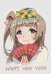  1girl blush brown_eyes brown_hair closed_mouth commentary_request english fan flower folding_fan grey_background hair_flower hair_ornament hand_up haoni happy_new_year holding holding_fan long_hair looking_at_viewer love_live! love_live!_school_idol_project new_year one_side_up simple_background smile solo upper_body yellow_flower 