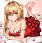  1girl ahoge bangs bare_shoulders barefoot blonde_hair blush breasts cleavage collarbone dress earrings eyebrows_visible_through_hair farys_(afopahqfw) fate/extra fate_(series) feet_up green_eyes hair_between_eyes hair_intakes highres jewelry large_breasts legs long_hair looking_at_viewer lying nero_claudius_(fate) nero_claudius_(fate)_(all) on_stomach petals red_dress rose_petals simple_background smile solo twintails white_background 