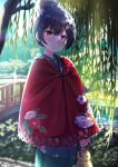  0141zucker 1girl blue_hair blue_kimono bridge commentary doll floral_print flower hair_bun hair_flower hair_ornament highres idolmaster idolmaster_shiny_colors japanese_clothes kimono looking_at_viewer morino_rinze outdoors parted_lips red_cloak red_eyes short_hair solo tree_shade 