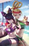 2girls arm_around_shoulder beach bike_shorts blonde_hair blue_eyes cammy_white clenched_hand commentary cup drinking_straw gold han_juri headband highres jealous joanna_ladowska medal multiple_girls navel ocean purple_hair silver sitting smile stomach street_fighter street_fighter_ii_(series) street_fighter_iv_(series) thigh-highs violet_eyes water wristband 