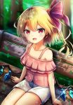  1girl ahoge bare_shoulders bench blonde_hair blurry blurry_background blush casual collarbone commentary_request contemporary crystal eyebrows_visible_through_hair flandre_scarlet hair_ribbon highres leaf looking_at_viewer no_hat no_headwear off-shoulder_shirt off_shoulder open_mouth pink_shirt red_eyes red_ribbon renka_(cloudsaikou) ribbon shirt short_hair short_shorts shorts side_ponytail sitting smile solo thighs touhou tree white_shorts wings 