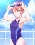  1girl adjusting_eyewear blue_swimsuit collarbone covered_navel day fence goggles goggles_on_head highres hoshizora_rin kanabun lamppost looking_at_viewer love_live! love_live!_school_idol_project one-piece_swimsuit orange_hair outdoors short_hair smile solo swimsuit yellow_eyes 