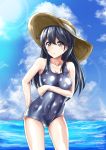  1girl arm_behind_back bird black_hair blue_sky blue_swimsuit breast_hold breasts brown_eyes clouds cloudy_sky collarbone eyebrows_visible_through_hair hat highres kantai_collection long_hair looking_at_viewer medium_breasts nakura_haru ocean one-piece_swimsuit open_mouth polka_dot polka_dot_swimsuit seagull sky sun_hat sunlight swimsuit ushio_(kantai_collection) 