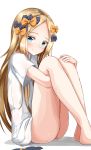  1girl abigail_williams_(fate/grand_order) absurdres ass bangs bare_legs barefoot black_bow black_panties blonde_hair blue_eyes blush bow bow_panties closed_mouth eyebrows_visible_through_hair fate/grand_order fate_(series) feet_out_of_frame forehead hair_bow head_tilt highres leg_hug long_hair looking_at_viewer moyoron naked_shirt orange_bow panties panties_removed parted_bangs polka_dot polka_dot_bow shirt short_sleeves sitting smile solo thighs underwear very_long_hair white_background white_shirt 