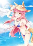  1girl animal_ears bikini blue_bikini breasts chunli495 cleavage day ears_through_headwear fang fate/grand_order fate_(series) fox_ears fox_tail groin hat highres large_breasts looking_at_viewer navel ocean open_mouth outdoors pink_hair side-tie_bikini solo straw_hat swimsuit tail tamamo_(fate)_(all) tamamo_no_mae_(swimsuit_lancer)_(fate) yellow_eyes 