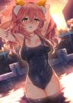  1girl animal_ears armpits arms_up blue_swimsuit blurry blurry_background blush breasts brown_eyes covered_navel cowboy_shot depth_of_field dusk dutch_angle eyebrows_visible_through_hair fate/grand_order fate_(series) fox_ears hair_between_eyes head_tilt highres kawai large_breasts long_hair looking_at_viewer open_mouth outdoors pink_hair pool solo sunset swimsuit tamamo_(fate)_(all) two_side_up wading water 