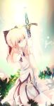  1girl ahoge artoria_pendragon_(all) black_ribbon blonde_hair blush bow caliburn dress fate/unlimited_codes fate_(series) gloves green_eyes hair_between_eyes hair_ribbon highres holding holding_weapon leaf looking_at_viewer ribbon saber_lily seiza sitting solo sword t.s weapon white_gloves 