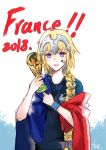  !! 1girl alternate_costume bangs blonde_hair blue_eyes bracelet braid eyebrows_visible_through_hair fate/grand_order fate_(series) flag french_flag headpiece highres holding jeanne_d&#039;arc_(fate) jeanne_d&#039;arc_(fate)_(all) jewelry long_braid long_hair looking_at_viewer open_mouth simple_background single_braid smile soccer soccer_uniform solo sportswear text_focus trophy very_long_hair yano_senyuki 