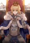  1girl artoria_pendragon_(all) b_rock blonde_hair blue_cape blurry blurry_background breastplate cape commentary_request crown depth_of_field fate/stay_night fate_(series) faulds fur_trim gauntlets gorget green_eyes highres hood hood_down hooded_cape light_particles looking_at_viewer parted_lips plate_armor saber sitting solo throne 