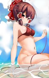  1girl bangs bare_arms bare_legs bare_shoulders barefoot bikini blue_sky blush bow breasts brown_hair closed_mouth clouds cloudy_sky commentary_request day eyebrows_visible_through_hair frilled_bow frills hair_between_eyes hair_bow hair_tubes hakurei_reimu hand_up head_tilt holding looking_at_viewer medium_breasts navel outdoors red_bikini red_bow red_eyes shallow_water side-tie_bikini sideboob sidelocks sitting sky smile solo suzunooto_shirasu swimsuit toenails touhou untied untied_bikini wariza water 