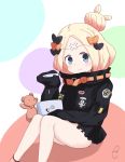  1girl abigail_williams_(fate/grand_order) bangs black_bow black_jacket blonde_hair blue_eyes blush bow closed_mouth commentary_request eyebrows_visible_through_hair fate/grand_order fate_(series) hair_bow hair_bun head_tilt highres holding jacket key kujou_karasuma long_sleeves looking_at_viewer orange_bow parted_bangs polka_dot polka_dot_bow signature sitting sleeves_past_fingers sleeves_past_wrists smile solo stuffed_animal stuffed_toy teddy_bear 
