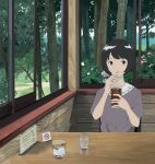  1girl absurdres black_hair cup day desk drinking_glass flower forest green_eyes grey_shirt gumi. highres holding holding_drinking_glass huge_filesize indoors looking_at_viewer nature no_smoking original parted_lips shirt short_hair short_sleeves sipping sitting smile solo sugar_bowl window 
