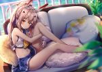  1girl ayanami_(azur_lane) azur_lane bangs bare_shoulders barefoot beach blonde_hair blue_skirt blush collar couch eyebrows_visible_through_hair hair_between_eyes headgear long_hair looking_at_viewer midriff navel ocean parted_lips pillow ponytail red_eyes riichu school_uniform serafuku shirt sitting skirt sleeveless solo stomach thighs white_shirt 