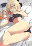  1girl absurdres ass bed_sheet black_bra black_panties blonde_hair bra breasts chikkinage_nage chips closed_mouth commentary crotch_seam eating eyebrows_visible_through_hair fate/grand_order fate_(series) food from_behind frown highres looking_at_viewer looking_back lying medium_breasts okita_souji_(fate) okita_souji_(fate)_(all) on_bed on_side panties pillow potato_chips short_hair solo strap_slip sweatdrop thighs underwear underwear_only yellow_eyes 