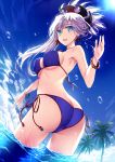  1girl alternate_costume ass bangs bare_arms bare_shoulders beach blue_eyes blue_sky breasts clouds colored_eyelashes day erect_nipples eyebrows_visible_through_hair fate/grand_order fate_(series) from_behind from_below hair_ornament highres large_breasts looking_at_viewer midriff miyamoto_musashi_(fate/grand_order) morizono_shiki ocean outdoors parted_lips pink_hair ponytail sky sunlight swimsuit tree wading water 