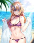  1girl beach bikini blue_eyes blue_sky breasts choker closed_mouth clouds day embarrassed eyebrows_visible_through_hair fate/grand_order fate_(series) headpiece highres jeanne_d&#039;arc_(fate) jeanne_d&#039;arc_(fate)_(all) large_breasts looking_at_viewer luobo_(nsnr8754) navel ocean purple_bikini purple_choker sky solo standing swimsuit towel wavy_mouth wet 