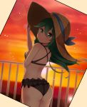  1girl ass bikini black_bikini black_ribbon cowboy_shot frilled_bikini_bottom from_behind green_hair hair_between_eyes hair_ornament hairclip hat kantai_collection long_hair looking_at_viewer looking_back orange_sky ponytail railing ribbon sira_(user_dswn7488) sky solo sun_hat sunset swimsuit yamakaze_(kantai_collection) 