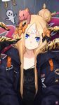  1girl abigail_williams_(fate/grand_order) animal_print bangs black_bow black_jacket black_shirt blonde_hair blue_eyes bow closed_mouth clothes_writing collarbone commentary_request crossed_bandaids english eyebrows_visible_through_hair eyes_visible_through_hair fate/grand_order fate_(series) hair_bow hair_bun head_tilt highres jacket long_hair long_sleeves mahousho object_hug orange_bow parted_bangs polka_dot polka_dot_bow print_shirt profanity shirt sleeves_past_fingers sleeves_past_wrists solo stuffed_animal stuffed_toy suction_cups teddy_bear tentacle tiger_print translated when_you_see_it 
