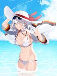  1girl alternate_costume arm_support armpits azur_lane baggy_clothes bangs bikini blue_eyes blush breasts cleavage coat collarbone cowboy_shot cross cross_earrings day earrings eyebrows_visible_through_hair eyewear_on_head groin hair_between_eyes hand_on_headwear hand_up hat head_tilt jewelry kinsenka_momi large_breasts looking_at_viewer one_eye_closed outdoors partially_submerged scarf short_hair sidelocks signature silver_hair skindentation solo sparkle standing stomach sun_hat sunglasses swimsuit thighs tirpitz_(azur_lane) water_drop white_bikini white_coat white_scarf wind wind_lift 