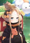  1girl abigail_williams_(fate/grand_order) balloon belt black_bow black_jacket blonde_hair blue_eyes blush bow closed_mouth fate/grand_order fate_(series) forehead hair_bow hair_bun highres hiyoko_(pixiv16803940) holding holding_stuffed_animal jacket long_hair looking_at_viewer medjed orange_bow sleeves_past_fingers sleeves_past_wrists solo stuffed_animal stuffed_toy teddy_bear 