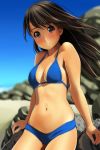  1girl arm_support bangs bare_arms bare_shoulders beach bikini black_eyes blue_bikini blue_sky blurry blurry_background blush breasts brown_hair closed_mouth collarbone commentary_request cute day depth_of_field eyebrows_visible_through_hair fingernails head_tilt highres long_hair matsunaga_kouyou navel nose_blush original outdoors sand sky small_breasts smile solo swimsuit 