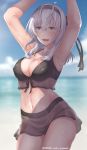  1girl armpits arms_up bangs beach bikini black_bikini black_headband blue_eyes breasts cleavage clouds cloudy_sky collarbone commentary cowboy_shot day edwin_(cyberdark_impacts) english_commentary front-tie_top hachimaki hair_between_eyes headband kantai_collection large_breasts miniskirt navel ocean outdoors see-through silver_hair skirt sky solo suzutsuki_(kantai_collection) swimsuit 