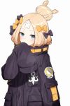  1girl abigail_williams_(fate/grand_order) bandaid_on_forehead bangs black_bow black_coat blonde_hair blue_eyes blush bow coat commentary_request covered_mouth fate/grand_order fate_(series) hair_bow hair_bun highres long_sleeves looking_at_viewer miruto_netsuki orange_bow parted_bangs polka_dot polka_dot_bow simple_background sleeves_past_fingers sleeves_past_wrists solo standing upper_body white_background 