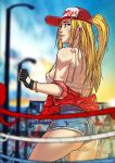  1girl ass back baseball_cap black_gloves blonde_hair blue_eyes blurry blurry_background bracelet breasts clothes_writing commentary commentary_typo cowboy_shot denim denim_shorts english english_commentary fatal_fury fine_fabric_emphasis fingerless_gloves ganassa genderswap genderswap_(mtf) gloves hat high-waist_shorts highres jewelry lips long_hair looking_back medium_breasts micro_shorts nose off_shoulder one_side_up shorts snk_heroines:_tag_team_frenzy solo strap_gap terry_bogard toned toon 