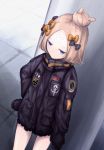  1girl abigail_williams_(fate/grand_order) bangs black_bow black_jacket blonde_hair blue_eyes bow closed_mouth commentary_request crossed_bandaids dutch_angle fate/grand_order fate_(series) hair_bow hair_bun hand_on_hip highres jacket key lit_ter long_hair long_sleeves orange_bow parted_bangs polka_dot polka_dot_bow sleeves_past_fingers sleeves_past_wrists solo standing star 