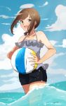  1girl ball beachball black_eyes black_hair commentary_request dress frilled_dress frills fubuki_(kantai_collection) highres kantai_collection low_ponytail miku-moko ponytail short_ponytail shorts sidelocks solo swimsuit wading 