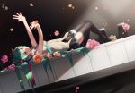  1girl black_background black_legwear dutch_angle flower from_side full_body green_eyes green_hair hatsune_miku long_hair lying minigirl necktie on_back outstretched_arms piano_keys pleated_skirt skirt solo thigh-highs very_long_hair vocaloid yamai_fake 