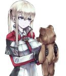  1girl black_gloves blonde_hair blue_eyes capelet commentary_request cross gloves graf_zeppelin_(kantai_collection) hair_between_eyes jacket kantai_collection kurou_(bcrow) long_hair military military_uniform necktie sidelocks simple_background solo standing stuffed_animal stuffed_toy teddy_bear tsurime twintails uniform white_background 