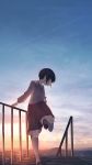  1girl absurdres adjusting_footwear black_hair commentary_request condensation_trail dusk highres holding_railing kneehighs long_sleeves mifuru neckerchief original outdoors railing school_uniform serafuku shoes short_hair skirt solo standing standing_on_one_leg 