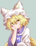  1girl absurdres blonde_hair blush closed_mouth commentary_request eyebrows_visible_through_hair fox_tail green_background hand_on_own_cheek hat highres hiro_(pqtks113) looking_at_viewer short_hair simple_background smile solo tail touhou upper_body yakumo_ran yellow_eyes 
