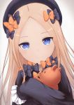  1girl abigail_williams_(fate/grand_order) absurdres bangs black_bow black_dress black_hat blue_eyes bow closed_mouth commentary_request coraman dress dutch_angle eyebrows_visible_through_hair fate/grand_order fate_(series) forehead gradient gradient_background grey_background hair_bow hat highres light_brown_hair long_hair long_sleeves object_hug orange_bow parted_bangs pixiv_fate/grand_order_contest_2 polka_dot polka_dot_bow sleeves_past_fingers sleeves_past_wrists smile solo stuffed_animal stuffed_toy teddy_bear very_long_hair 