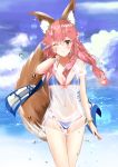  1girl animal_ears bangs bikini bikini_under_clothes blue_bikini blue_sky blush breasts brown_eyes cleavage clouds cloudy_sky collarbone commentary_request day eyebrows_visible_through_hair fate/grand_order fate_(series) fox_ears fox_girl fox_tail hair_between_eyes head_tilt highres long_hair looking_at_viewer medium_breasts navel ocean one_eye_closed outdoors pink_hair see-through shirt short_sleeves sky solo swimsuit tail tail_raised tamamo_(fate)_(all) tamamo_no_mae_(swimsuit_lancer)_(fate) teratsuki water wet wet_clothes wet_shirt white_shirt 