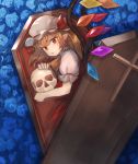  1girl ascot bangs blonde_hair blue_flower blue_rose coffin commentary_request cross crystal eyebrows_visible_through_hair eyelashes flandre_scarlet flower from_above hair_between_eyes hat hat_ribbon holding holding_skull in_container kasuka_(kusuki) looking_at_viewer lying mob_cap on_side one_side_up parted_lips pointy_ears puffy_short_sleeves puffy_sleeves red_eyes red_ribbon red_skirt red_vest ribbon rose shirt short_sleeves skirt skirt_set skull slit_pupils solo touhou vest white_hat white_shirt wing_collar wings yellow_neckwear 