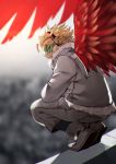 1boy 55level ankle_boots blonde_hair blurry blurry_background boku_no_hero_academia boots brown_eyes coat day depth_of_field feathered_wings from_behind full_body fur_collar glaring goggles grey_coat grey_footwear grey_pants hawks_(boku_no_hero_academia) headphones highres long_sleeves looking_at_viewer looking_back male_focus outdoors pants red_wings rooftop solo squatting thick_eyebrows wings winter_clothes winter_coat