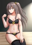  1girl bangs bare_arms bare_shoulders black_bra black_legwear black_panties blush bow bow_bra bow_panties bra breasts brown_eyes brown_hair cleavage closed_mouth collarbone commentary eyebrows_visible_through_hair girls_frontline groin hair_between_eyes hair_ornament highres jewelry kazenokaze long_hair looking_at_viewer medium_breasts navel one_side_up panties pulled_by_self ring scar scar_across_eye sitting smile solo strap_slip thigh-highs ump45_(girls_frontline) underwear underwear_only very_long_hair wedding_band yellow_bow 