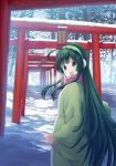  1girl blush brown_eyes day earmuffs eyebrows_visible_through_hair green_hair highres isou_nagi looking_at_viewer open_mouth outdoors real_world_location scarf scenery smile snow solo standing torii touhoku_zunko translation_request vocaloid voiceroid 