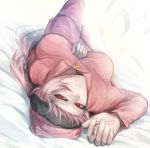  1girl bed bed_sheet blush braid fate/grand_order fate_(series) feathers florence_nightingale_(fate/grand_order) kanjou_jouki long_sleeves looking_at_viewer lying on_bed pajamas pink_hair red_eyes single_braid 