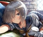  1girl backlighting bangs black_legwear blue_eyes blue_skirt blurry blurry_background blush breasts clenched_hand collarbone couch day dust_particles eyebrows_visible_through_hair gloves hair_ornament hair_over_one_eye hairclip hamakaze_(kantai_collection) highres indoors kantai_collection large_breasts lolicept looking_at_viewer lying neckerchief on_stomach pantyhose parted_lips pleated_skirt school_uniform serafuku shirt short_hair short_sleeves sidelocks silver_hair skirt solo white_gloves white_shirt window yellow_neckwear 