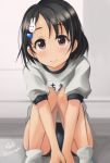  1girl black_eyes black_hair blue_buruma buruma commentary_request gym_uniform hair_ornament hairclip hands_together haruhina0104 idolmaster idolmaster_cinderella_girls sasaki_chie shirt short_hair sitting smile socks solo v_arms white_shirt 