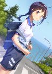  1girl ahoge artist_name bag black_shorts blue_sky blush braid breasts brown_eyes brown_hair collared_shirt commentary_request cowboy_shot crosswalk day duffel_bag dutch_angle from_side gym_uniform highres lamppost light_smile long_hair looking_at_viewer looking_to_the_side nose_blush ocean original outdoors pairan parted_lips road shiny shiny_hair shirt short_sleeves shorts sidelocks single_braid sky small_breasts solo street town tree 