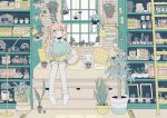  1girl alarm_clock book bookshelf cactus clock collared_shirt green green_shirt ladder lamp leaf limited_palette long_hair long_sleeves muted_color noeru_(noellemonade) open_book original pillow pink_hair plaid_pillow plant plant_request potted_plant shirt shorts sitting smile socks solo yellow_pillow 